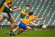 22 December 2020; Keith Evans, centre, of Kerry shoots to score his side's first goal despite the efforts of Fionn Kelleher of Clare during the Electric Ireland Munster GAA Football Minor Championship Final match between Kerry and Clare at LIT Gaelic Grounds in Limerick. Photo by Eóin Noonan/Sportsfile