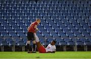22 December 2020; Success Edogun of St Patrick's Athletic is assisted by Bohemians' Adam Feeney after suffering with cramp during the SSE Airtricity U19 National League Final match between Bohemians and St Patrick’s Athletic at the UCD Bowl in Dublin. Photo by Seb Daly/Sportsfile