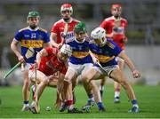 23 December 2020; Tommy O’Connell of Cork in action against Kevin McCarthy, 9, and Devon Ryan of Tipperary during the Bord Gáis Energy Munster GAA Hurling U20 Championship Final match between Cork and Tipperary at Páirc Uí Chaoimh in Cork. Photo by Piaras Ó Mídheach/Sportsfile