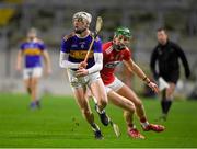 23 December 2020; Eoghan Connolly of Tipperary in action against Colin O'Brien of Cork during the Bord Gáis Energy Munster GAA Hurling U20 Championship Final match between Cork and Tipperary at Páirc Uí Chaoimh in Cork. Photo by Matt Browne/Sportsfile