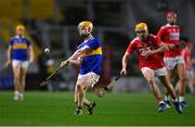 23 December 2020; Andrew Ormond of Tipperary shoots under pressure from Darragh Flynn of Cork during the Bord Gáis Energy Munster GAA Hurling U20 Championship Final match between Cork and Tipperary at Páirc Uí Chaoimh in Cork. Photo by Piaras Ó Mídheach/Sportsfile