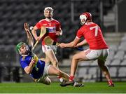 23 December 2020; James Devaney of Tipperary loses his footing as Dáire O’ Leary of Cork closes in during the Bord Gáis Energy Munster GAA Hurling U20 Championship Final match between Cork and Tipperary at Páirc Uí Chaoimh in Cork. Photo by Piaras Ó Mídheach/Sportsfile
