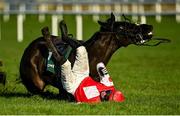 27 December 2020; Jungle Junction and jockey Paddy Kennedy fall at the last during the Paddy Power Games 'Don't Think You're Special' Beginners Steeplechase on day two of the Leopardstown Christmas Festival at Leopardstown Racecourse in Dublin. Photo by Seb Daly/Sportsfile