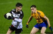 26 December 2020; Adam Gallagher of Sligo in action against Conor Hand of Roscommon during the Electric Ireland Connacht GAA Football Minor Championship Final match between Roscommon and Sligo at Connacht Centre of Excellence in Bekan, Mayo. Photo by Ramsey Cardy/Sportsfile