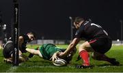 27 December 2020; Jack Carty of Connacht scores his side's first try despite the tackle of Andrew Warwick of Ulster during the Guinness PRO14 match between Connacht and Ulster at The Sportsground in Galway. Photo by Ramsey Cardy/Sportsfile