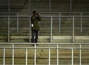 1 January 2021; Trainer Willie Mullins watches from the empty grandstand during the Goodbye 2020 Hello 2021 Maiden Hurdle at Tramore Racecourse in Waterford. Photo by Seb Daly/Sportsfile