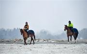 7 January 2021; Trainer Diego Dias, right, and stable hand Diego Lima make their way to the gallops at the Curragh, in Kildare. Photo by Seb Daly/Sportsfile