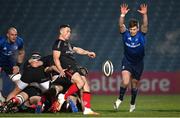 8 January 2021; John Cooney of Ulster attempts a box kick under pressure from Ross Byrne of Leinster during the Guinness PRO14 match between Leinster and Ulster at the RDS Arena in Dublin. Photo by Ramsey Cardy/Sportsfile