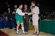 8 June 1994; President Mary Robinson presents the cup to Ireland captain Mark Keenan lifts the cup after the 1994 Promotions Cup Final match between Ireland and Cyprus at the National Basketball Arena in Tallaght, Dublin. Photo by Ray McManus/Sportsfile