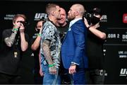 21 January 2021; Dustin Poirier, left, and Conor McGregor face off for media during the UFC 257 press conference prior to UFC 257 at the Etihad Arena on Yas Island in Abu Dhabi, United Arab Emirates. Photo by Jeff Bottari/Zuffa LLC/Getty Images via Sportsfile