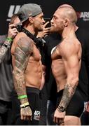 22 January 2021; Dustin Poirier, left, and Conor McGregor face off during the UFC 257 weigh-in at the Etihad Arena on UFC Fight Island in Abu Dhabi, United Arab Emirates. Photo by Jeff Bottari/Zuffa LLC/Getty Images via Sportsfile