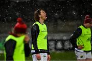 23 January 2021; Ben Healy of Munster tastes the snow during his warm up prior to the Guinness PRO14 match between Munster and Leinster at Thomond Park in Limerick. Photo by Ramsey Cardy/Sportsfile
