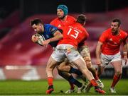 23 January 2021; Hugo Keenan of Leinster is tackled by Tadhg Beirne and Chris Farrell of Munster during the Guinness PRO14 match between Munster and Leinster at Thomond Park in Limerick. Photo by Eóin Noonan/Sportsfile