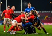 23 January 2021; Mike Haley of Munster is tackled by Luke McGrath and Hugo Keenan of Leinster during the Guinness PRO14 match between Munster and Leinster at Thomond Park in Limerick. Photo by Ramsey Cardy/Sportsfile