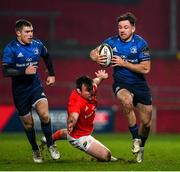 23 January 2021; Hugo Keenan of Leinster beats the tackle of Niall Scannell of Munster during the Guinness PRO14 match between Munster and Leinster at Thomond Park in Limerick. Photo by Ramsey Cardy/Sportsfile