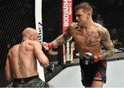 24 January 2021; Conor McGregor, left, and Dustin Poirier during their UFC 257 Lightweight bout at the Etihad Arena in Abu Dhabi, United Arab Emirates. Photo by Jeff Bottari/Zuffa LLC/Getty Images via Sportsfile