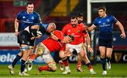 23 January 2021; Rhys Ruddock of Leinster is tackled by Gavin Coombes of Munster during the Guinness PRO14 match between Munster and Leinster at Thomond Park in Limerick. Photo by Ramsey Cardy/Sportsfile