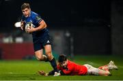 23 January 2021; Jordan Larmour of Leinster evades the tackle of Conor Murray of Munster during the Guinness PRO14 match between Munster and Leinster at Thomond Park in Limerick. Photo by Ramsey Cardy/Sportsfile