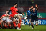 23 January 2021; Rhys Ruddock of Leinster attempts to charge down a kick by Conor Murray of Munster during the Guinness PRO14 match between Munster and Leinster at Thomond Park in Limerick. Photo by Ramsey Cardy/Sportsfile