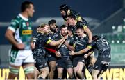 30 January 2021; JJ Hanrahan of Munster is congratulated by team-mates Jeremy Loughman, Damien de Allende, Rory Scannell, Chris Cloete, top, and Tommy O'Donnell after kicking a drop goal to win the Guinness PRO14 match between Benetton and Munster at Stadio Monigo in Treviso, Italy. Photo by Roberto Bregani/Sportsfile