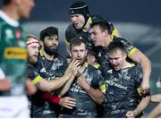 30 January 2021; JJ Hanrahan of Munster is congratulated by team-mates Jeremy Loughman, Damien de Allende, Rory Scannell, Chris Cloete, top, and Tommy O'Donnell after kicking a drop goal to win the Guinness PRO14 match between Benetton and Munster at Stadio Monigo in Treviso, Italy. Photo by Roberto Bregani/Sportsfile