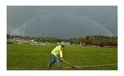 9 February 2020; Framed by a perfect rainbow and undaunted by a threatening sky, St Eunan’s club official Daniel McGlynn continues to work on the pitch at O’Donnell Park. Photo by Oliver McVeigh/Sportsfile This image may be reproduced free of charge when used in conjunction with a review of the book &quot;A Season of Sundays 2020&quot;. All other usage © Sportsfile
