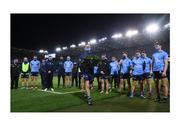21 November 2020; The same sky blue. After putting Meath to the sword, the 2020 Leinster football champions walk to the corner of Croke Park where Michael Hogan was shot dead and team captain Stephen Cluxton places a wreath in honour of the 14 lives lost on Bloody Sunday. Their forefathers and previous holders of the shirt appeared in the challenge fixture against Tipperary on that fateful day and, for this occasion, the Dublin players wear specially designed jerseys which had the number 14 on one sleeve with the names of each of the victims inside and the GAA commemorative logo on the other sleeve. Photo by Stephen McCarthy/Sportsfile This image may be reproduced free of charge when used in conjunction with a review of the book &quot;A Season of Sundays 2020&quot;. All other usage © Sportsfile