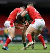 7 February 2021; Hugo Keenan of Ireland is tackled by Hallam Amos and George North of Wales during the Guinness Six Nations Rugby Championship match between Wales and Ireland at the Principality Stadium in Cardiff, Wales. Photo by Chris Fairweather/Sportsfile