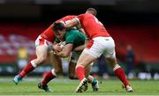 7 February 2021; Hugo Keenan of Ireland is tackled by Hallam Amos and George North of Wales during the Guinness Six Nations Rugby Championship match between Wales and Ireland at the Principality Stadium in Cardiff, Wales. Photo by Chris Fairweather/Sportsfile
