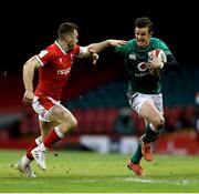 7 February 2021; Billy Burns of Ireland is tackled by Gareth Davies of Wales during the Guinness Six Nations Rugby Championship match between Wales and Ireland at the Principality Stadium in Cardiff, Wales. Photo by Gareth Everett/Sportsfile