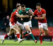 7 February 2021; Billy Burns of Ireland is tackled by Gareth Davies and Louis Rees-Zammit of Wales during the Guinness Six Nations Rugby Championship match between Wales and Ireland at the Principality Stadium in Cardiff, Wales. Photo by Gareth Everett/Sportsfile