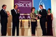 4 December 1998; Meath footballer John McDermott is presented with his Eircell GAA All Star award by President Mary McAleese, in the company of Uachtarán Chumann Lúthchleas Gael Joe McDonagh, left, Eircell CEO Stephen Brewer, and Eircell hostess and the current Rose of Tralee Luzveminda O'Sullivan, during the 1998 Eircell GAA All Star Awards Banquet at The Burlington Hotel in Dublin. Photo by Ray McManus/Sportsfile