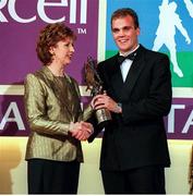 4 December 1998; Meath footballer John McDermott is presented with his Eircell GAA All Star award by President Mary McAleese during the 1998 Eircell GAA All Star Awards Banquet at The Burlington Hotel in Dublin. Photo by Brendan Moran/Sportsfile