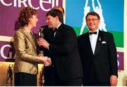 4 December 1998; Offaly hurler Martin Hanamy is presented with his Eircell GAA All Star award by President Mary McAleese, in the company of Uachtarán Chumann Lúthchleas Gael Joe McDonagh, right, and Eircell CEO Stephen Brewer, during the 1998 Eircell GAA All Star Awards Banquet at The Burlington Hotel in Dublin. Photo by Brendan Moran/Sportsfile