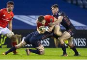 20 February 2021; Andrew Conway of Munster is tackled by Andrew Davidson of Edinburgh during the Guinness PRO14 match between Edinburgh and Munster at BT Murrayfield Stadium in Edinburgh, Scotland. Photo by Paul Devlin/Sportsfile