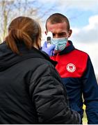 21 February 2021; John Mountney of St Patrick's Athletic has his temperature taken on arrival prior to the pre-season friendly match between Cork City and St Patrick's Athletic at O'Shea Park in Blarney, Cork. Photo by Eóin Noonan/Sportsfile