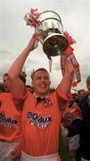 4 May 1997; Dave Campbell of Shelbourne celebrates with the trophy following his side's victory during the FAI Cup Final match between Derry City and Shelbourne at Dalymount Park in Dublin. Photo by Brendan Moran/Sportsfile