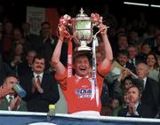 4 May 1997; Shelbourne captain Mick Neville lifts the FAI Cup, watched over by FAI Chief Executive  Bernard O'Byrne, left, following his side's victory during the FAI Cup Final match between Derry City and Shelbourne at Dalymount Park in Dublin. Photo by Brendan Moran/Sportsfile