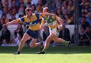 22 August 1998; Ollie Cahill of Clare in action against Joe Dooley of Offaly during the Guinness All-Ireland Hurling Senior Championship Semi-Final Replay match between Clare and Offaly at Croke Park in Dublin. Photo by Ray McManus/Sportsfile
