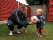 13 November 1998; Paul McGee of Athlone town, formally of Bohemians, St Patrick's Athletic, Colchester United and Wimbledon, with his son Ryan, aged 18 months, at his home in Dublin. Photo by David Maher/Sportsfile