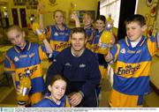 30 January 2004; Dublin Footballer and Chief Executive of the GPA Dessie Farrell pictured with pupils from Cnoc Mhuire, Senior School, Killinarden, Tallaght, at the presentation of a full kit of gear to the boys and girls Gaelic teams by the C&C group( Club Energise). Picture credit; Matt Browne / SPORTSFILE *EDI*