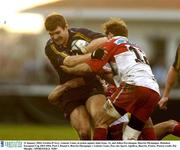31 January 2004; Gordon D'Arcy, Leinster Lions, in action against John Isaac, 12, and Julien Peyrelongue, Biarritz Olympique. Heineken European Cup 2003-2004, Pool 3, Round 6, Biarritz Olympique v Leinster Lions, Parc des Sports Aguilera, Biarritz, France. Picture credit; Pat Murphy / SPORTSFILE *EDI*