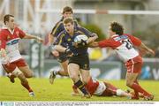 31 January 2004; Gordon D'Arcy, Leinster Lions, in action against Martin Gaitan, right, and Nicolas Brusque, Biarritz Olympique. Heineken European Cup 2003-2004, Pool 3, Round 6, Biarritz Olympique v Leinster Lions, Parc des Sports Aguilera, Biarritz, France. Picture credit; Pat Murphy / SPORTSFILE *EDI*