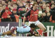 31 January 2004; Anthony Horgan, Munster, is tackled by Kevin Zhakata, Bourgoin. Heineken European Cup 2003-2004, Pool 5, Round 6, Munster v Bourgoin, Thomond Park, Limerick. Picture credit; Matt Browne / SPORTSFILE *EDI*