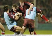 31 January 2004; John Kelly, Munster, with the ball, is tackled by Sebastien Chabl, Bourgoin while Anthony Horgan, Munster is tackled by Grant Esterhuizen . Heineken European Cup 2003-2004, Pool 5, Round 6, Munster v Bourgoin, Thomond Park, Limerick. Picture credit; Matt Browne / SPORTSFILE *EDI*