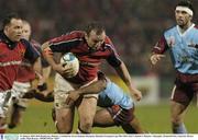 31 January 2004; Rob Henderson, Munster, is tackled by Kevin Zhakata, Bourgoin. Heineken European Cup 2003-2004, Pool 5, Round 6, Munster v Bourgoin, Thomond Park, Limerick. Picture credit; Matt Browne / SPORTSFILE *EDI*