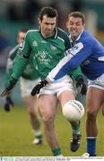 1 February 2004; Muiris Gavin, Limerick, is tackled by Darren Rooney, Laois. Allianz National Football League Division 1A, Limerick v Laois, Gaelic Grounds, Limerick. Picture credit; Matt Browne / SPORTSFILE *EDI*