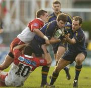 31 January 2004; Gordon D'Arcy, Leinster Lions, assisted by team-mate Girvan Dempsey, right, in action against Nicolas Brusque, and Julien Peyrelongue, 10, Biarritz Olympique. Heineken European Cup 2003-2004, Pool 3, Round 6, Biarritz Olympique v Leinster Lions, Parc des Sports Aguilera, Biarritz, France. Picture credit; Pat Murphy / SPORTSFILE *EDI*