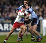 1 February 2004; Colin Holmes, Tyrone, in action against Declan Lally, Dublin. Allianz National Football League Division 1A, Dublin v Tyrone, Parnell Park, Dublin. Picture credit; Damien Eagers / SPORTSFILE *EDI*