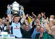 7 July 2013; Dublin captain John McCaffrey lifts the Bob O'Keeffe Cup at the end of the game watched on by former Dublin manager Humphrey Kelleher. Leinster GAA Hurling Senior Championship Final, Galway v Dublin, Croke Park, Dublin. Picture credit: David Maher / SPORTSFILE